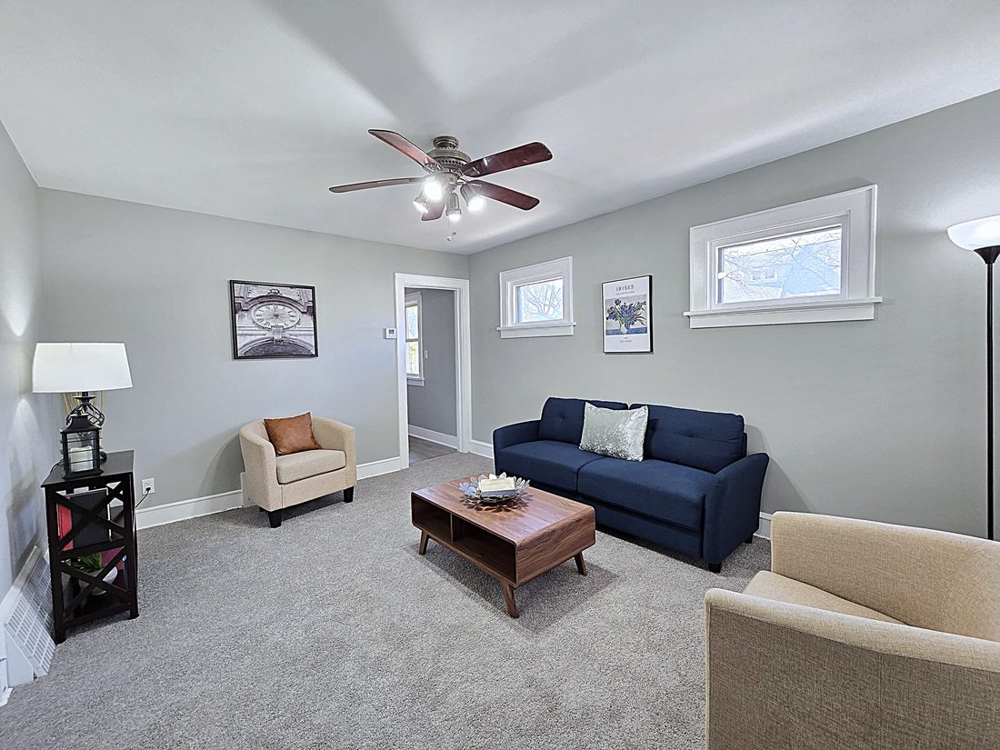 Open living space with freshly painted walls after a full renovation in Cudahy, WI