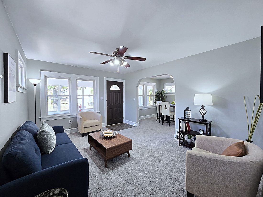 Renovated open living room with new carpet and fresh paint in a Cudahy, WI home