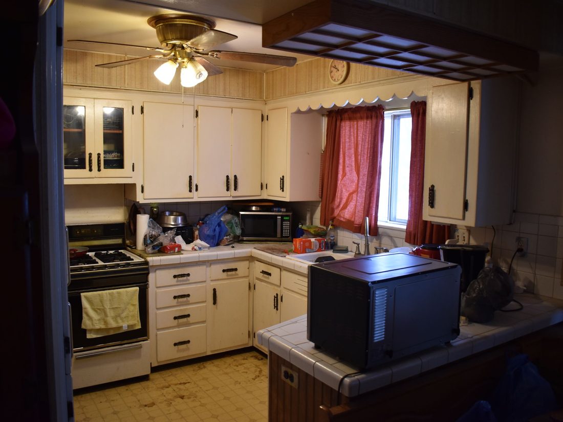 Dated Cudahy kitchen with original cabinets and appliances before renovation