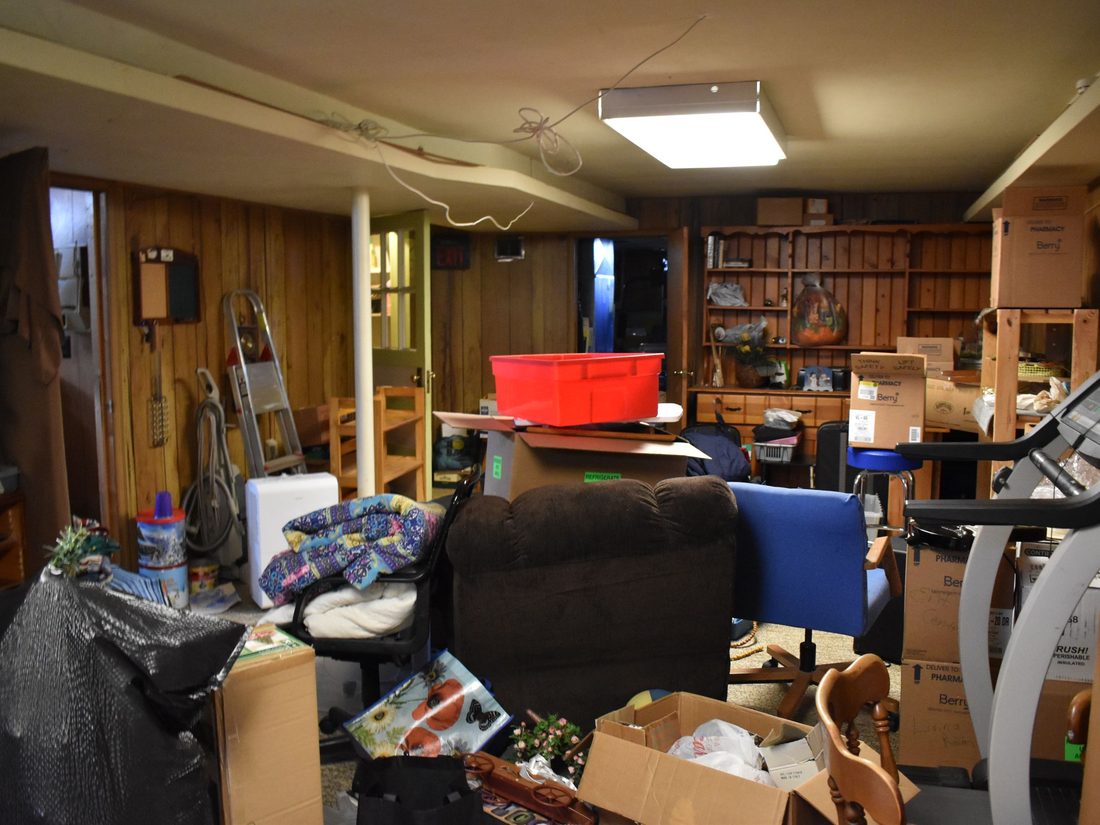 Basement packed with stored items before the cleanout