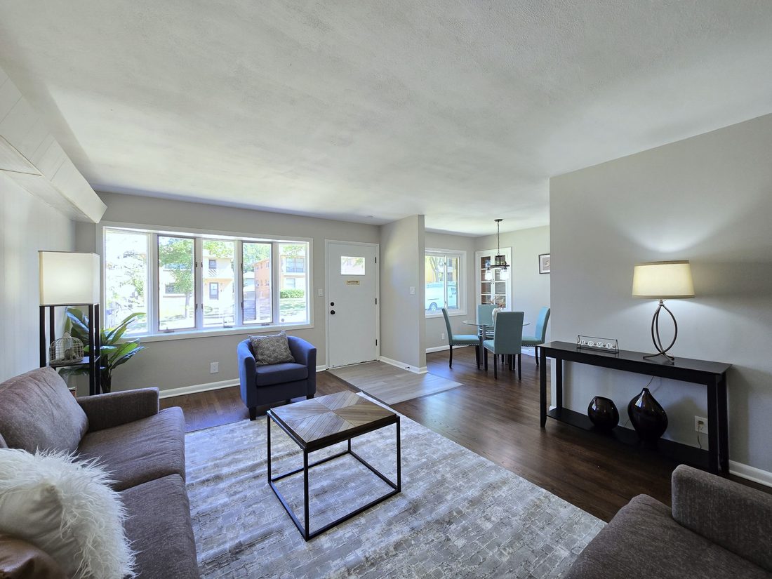 Bright open living and dining room after a full renovation in a Milwaukee home