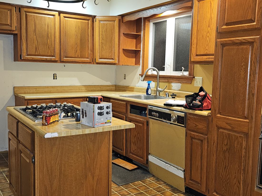 Dated oak kitchen with a centre island in a Stoughton, Wisconsin home
