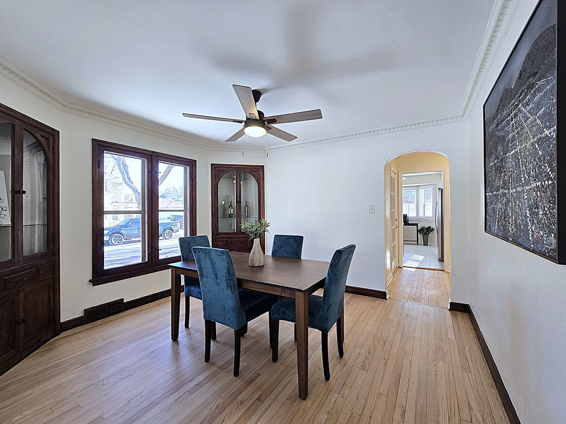 Dining room with original built-in china cabinets and refinished hardwoods