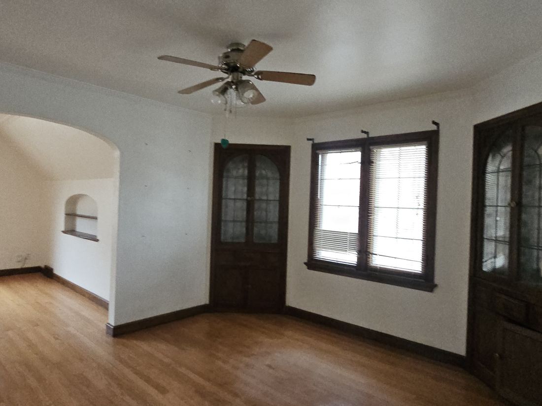 Arched doorway and original hardwood floors in the Waukesha bungalow
