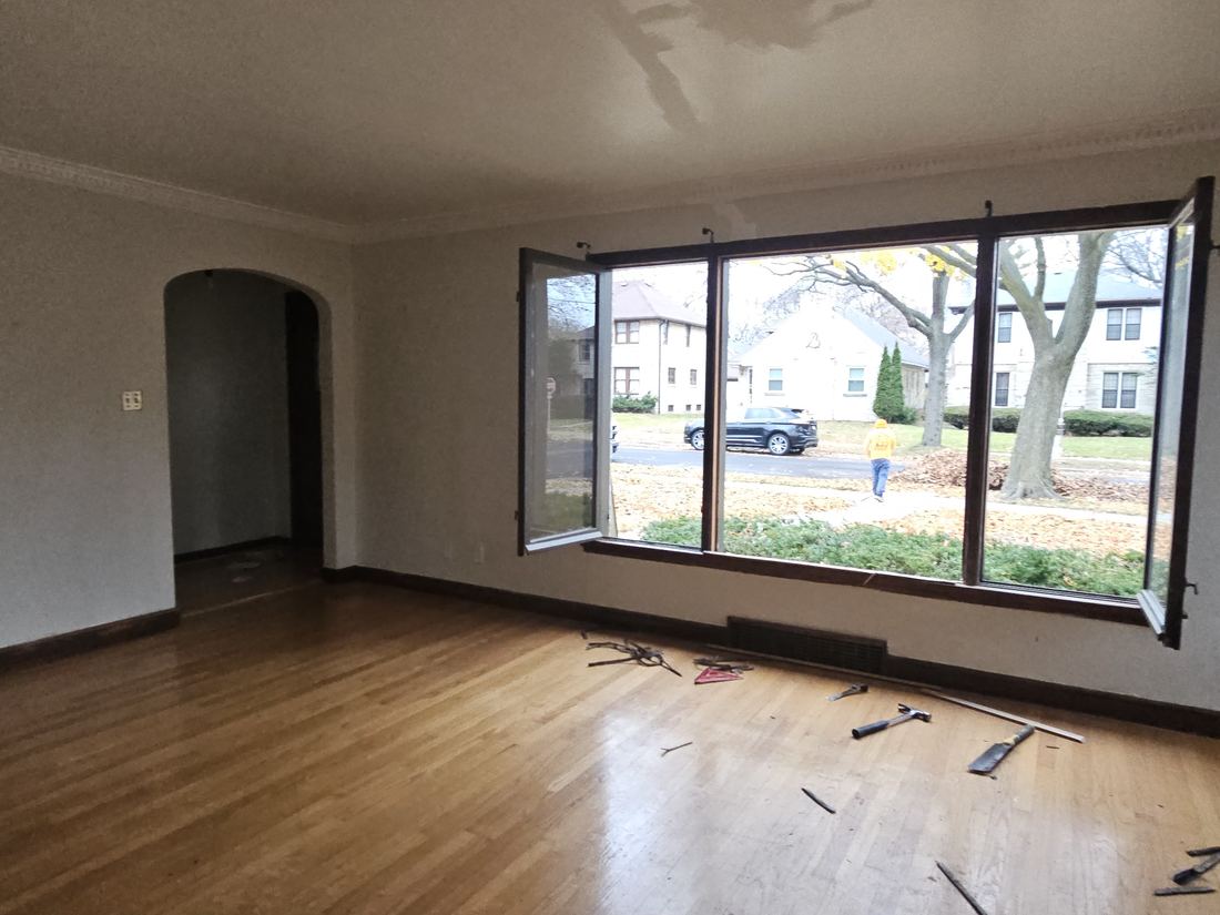 Living room with a wide picture window in a 1930s Waukesha bungalow