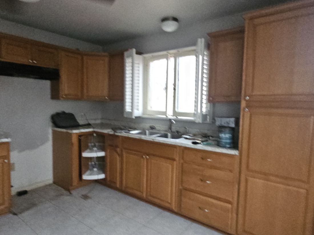 Dated oak kitchen in the Waukesha bungalow